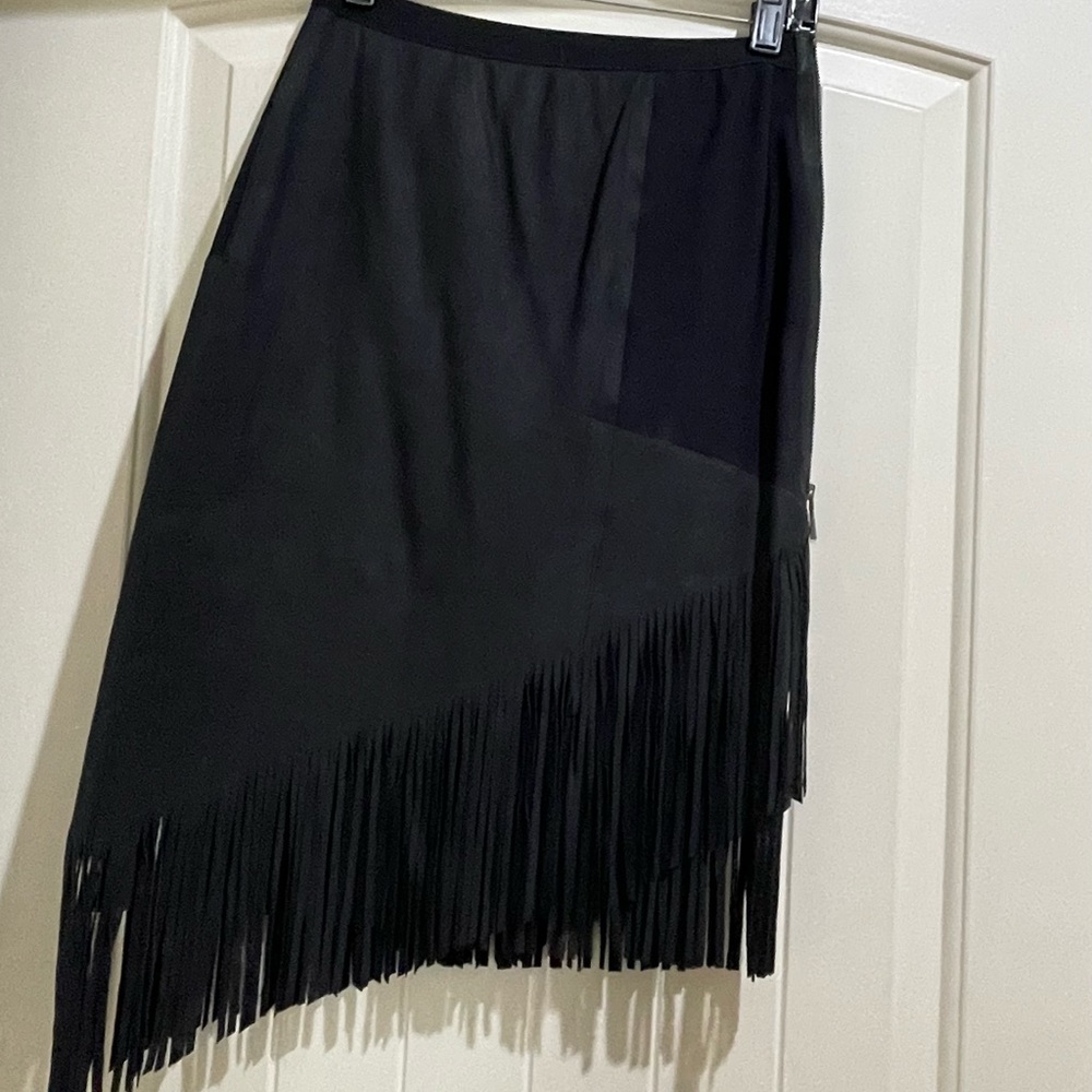 Slightly work Elie Tahari leather fringe angle skirt.